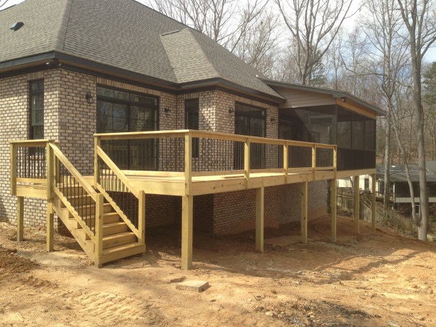 Deck with screened porch, bead board ceilings, and aluminum pickets. 