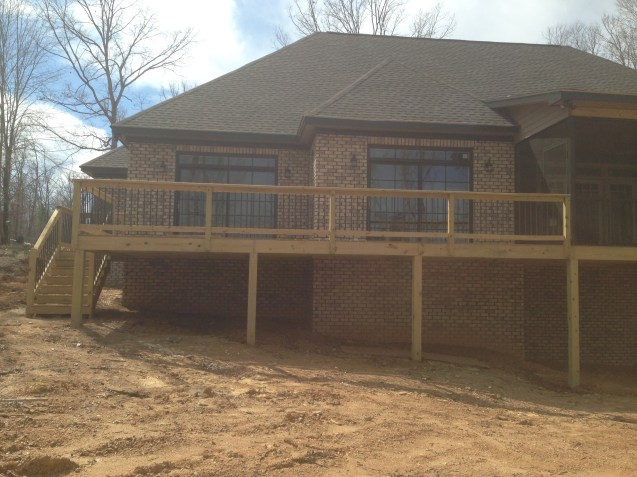 Deck with screened porch, bead board ceilings, and aluminum pickets. 