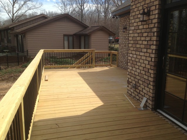 Deck with screened porch, bead board ceilings, and aluminum pickets. 